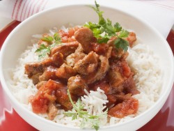 sliced-veal-with-tomato-sauce-over-rice-529226.jpg